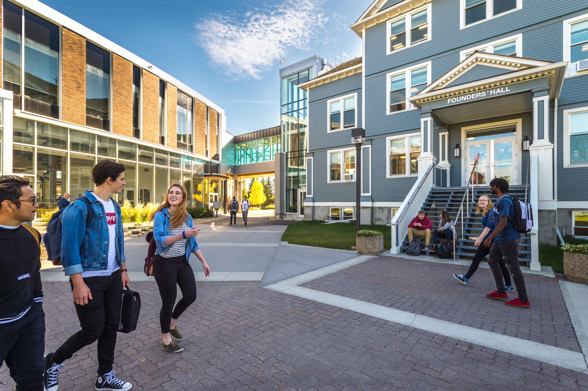 Students walking in front of Founders' Hall on Augustana Campus