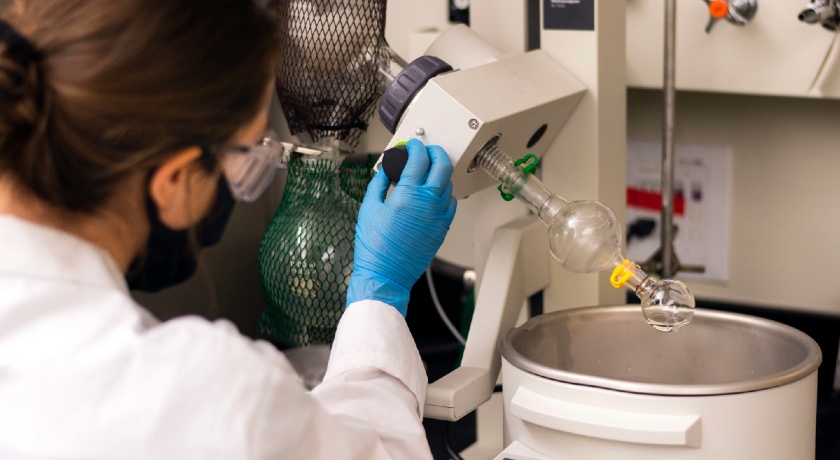 A photo of a student working in an undergraduate chemistry lab.