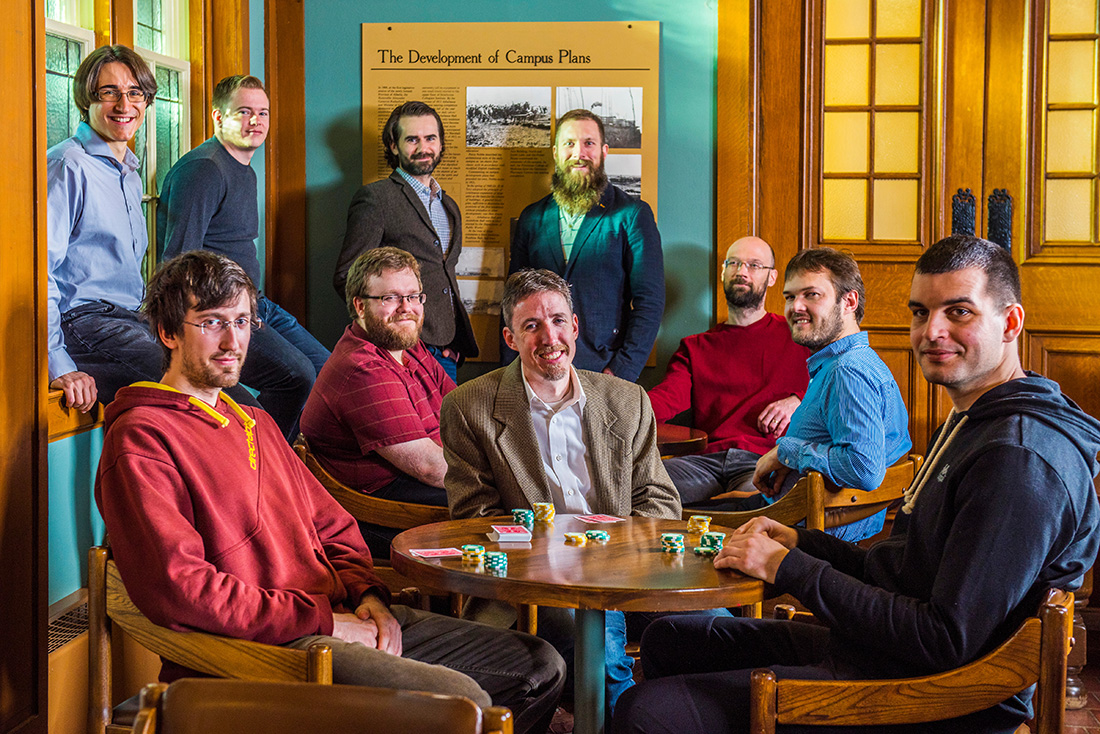 Michael Bowling (centre) flanked by co-authors of DeepStack